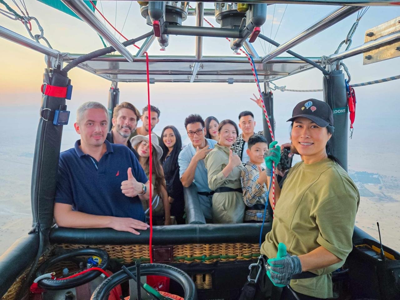 Guests in the balloon basket at sunrise